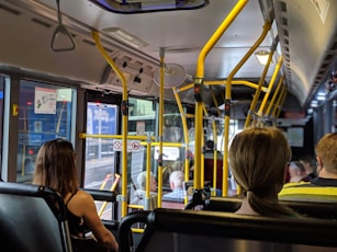 people sitting down inside vehicle