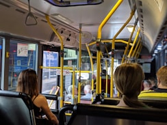 people sitting down inside vehicle