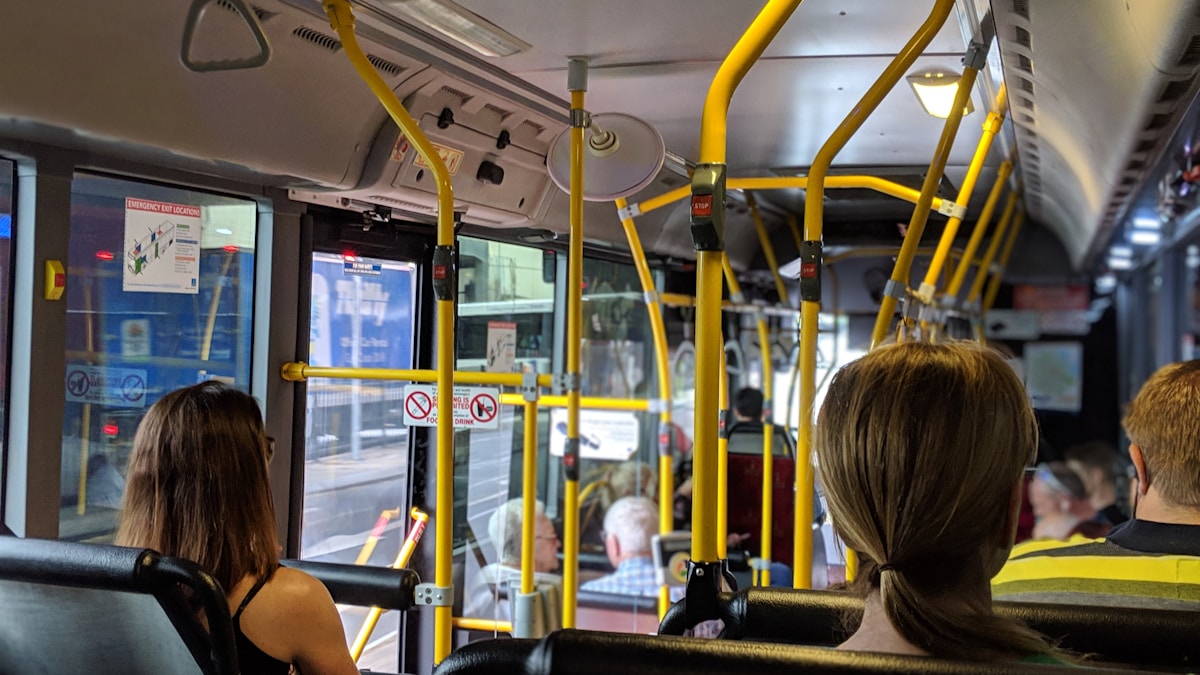 people sitting down inside vehicle