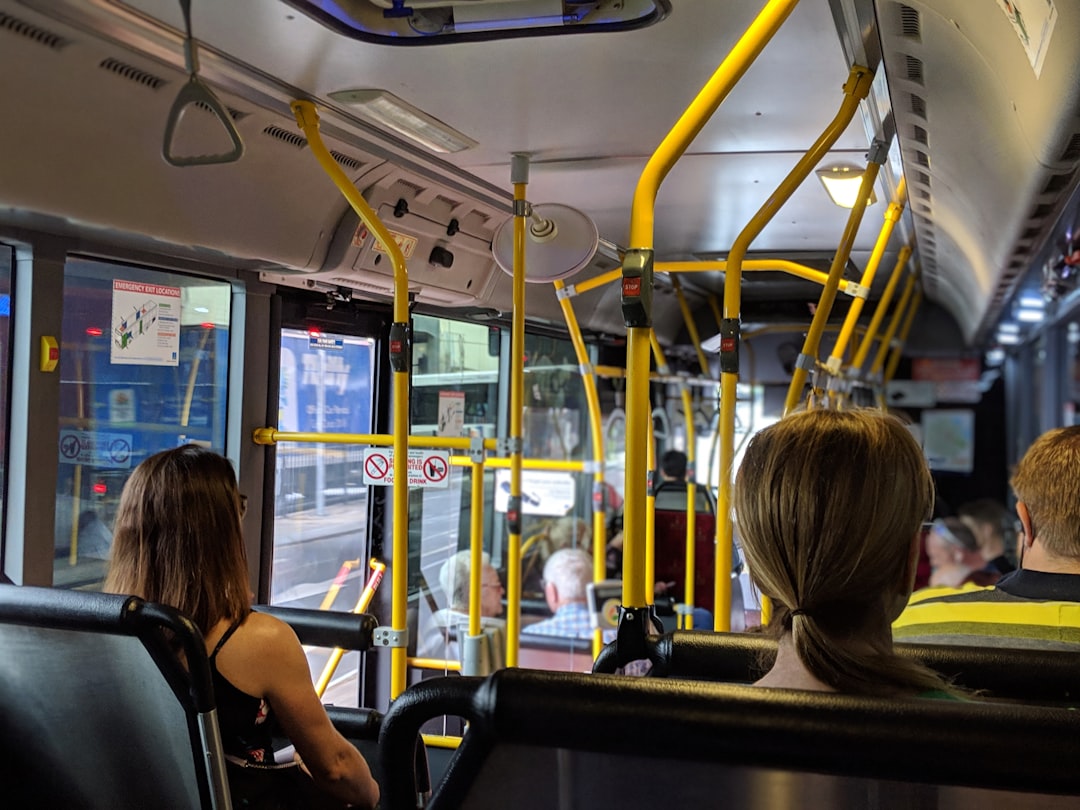 people sitting down inside vehicle,