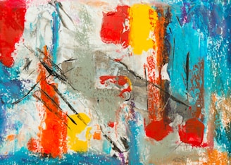 An abstract painting featuring bold, vibrant brushstrokes and splashes of color. The composition includes large areas of red, yellow, turquoise, and orange, interspersed with grey and white, creating a dynamic sense of movement. The use of black lines adds contrast and depth to the piece.