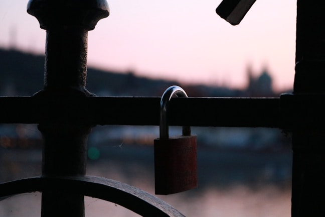 A locksmith technician unlocking a residential door in Lisbon neighborhood at dusk
