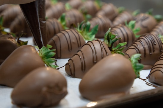 A beautifully arranged display of chocolate-covered strawberries.