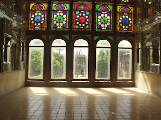 Elegant vitreaux window featuring colorful stained glass in a cozy room