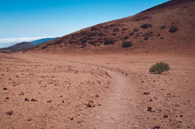 brown rough road near hill ground zoom background