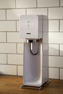 white Soda maker on desk