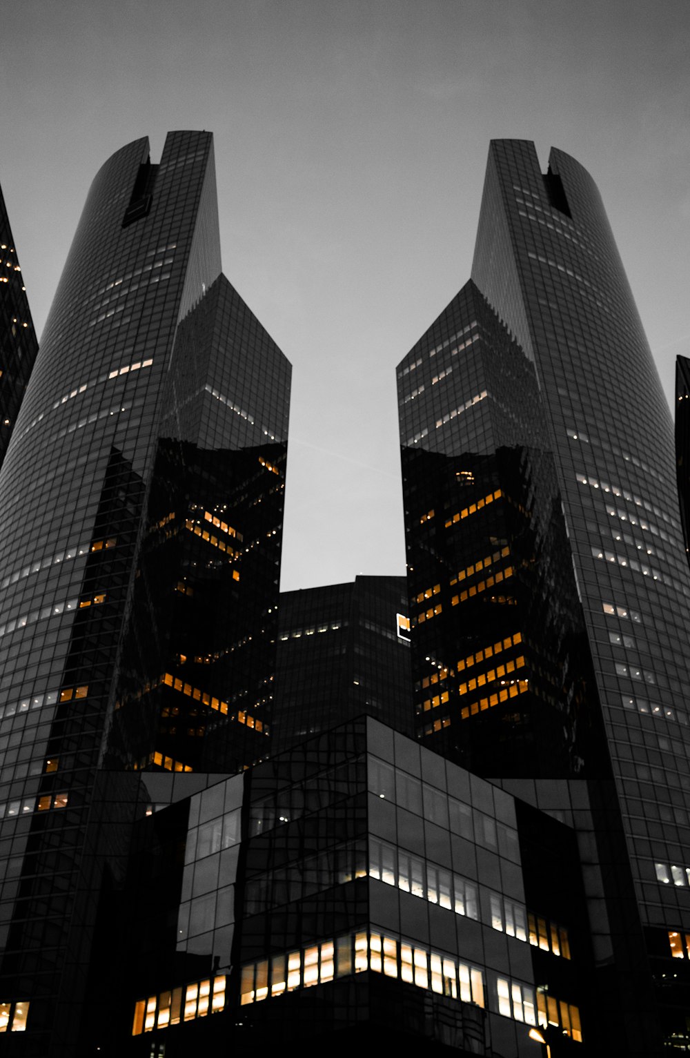 low angle photo of curtain glass wall buildings