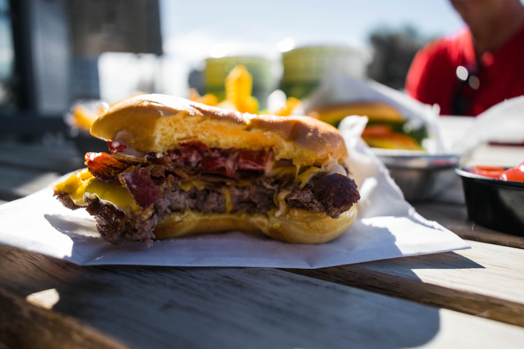 close-up photography of hambuger on white textile