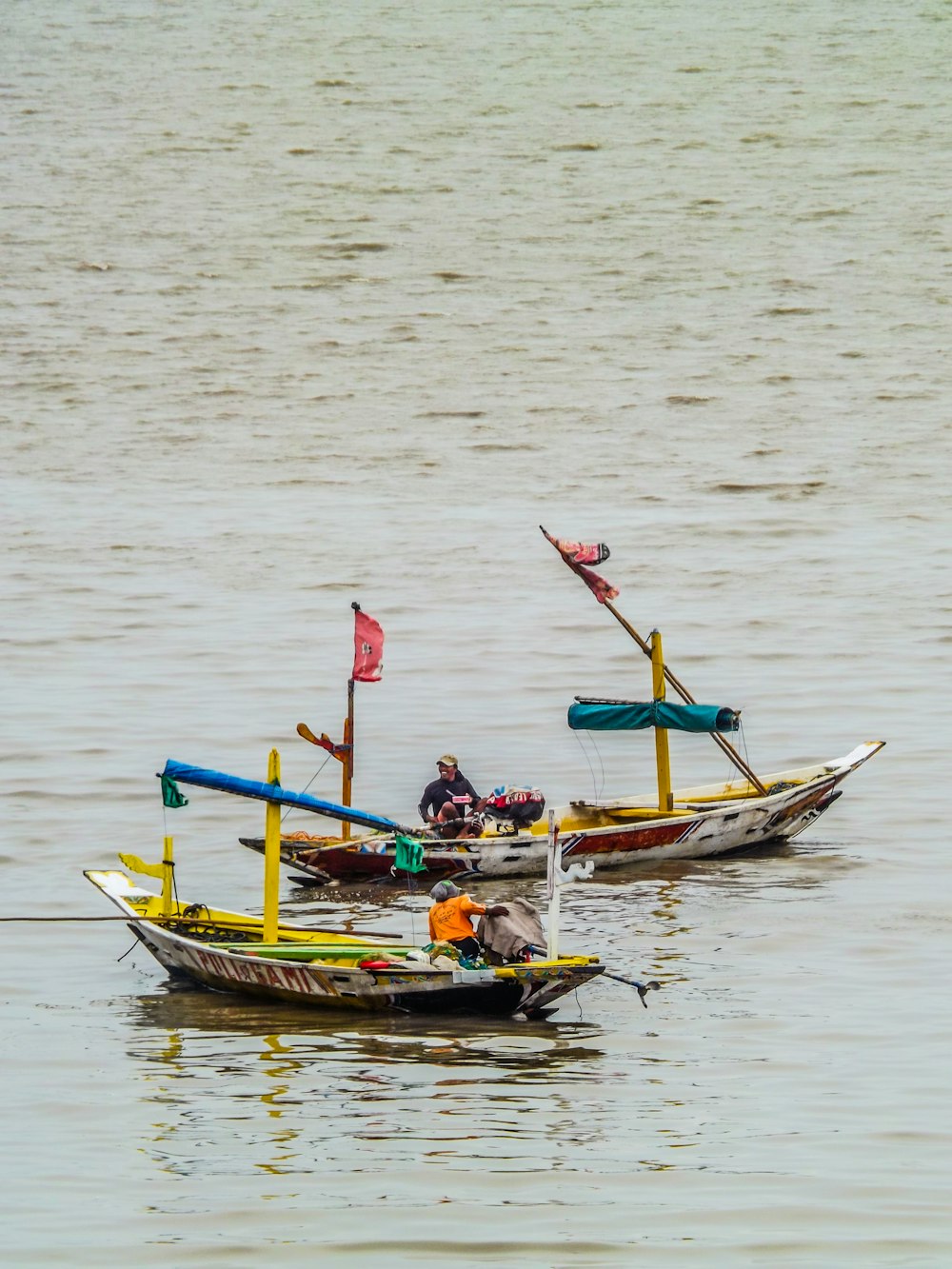 two men riding on boats