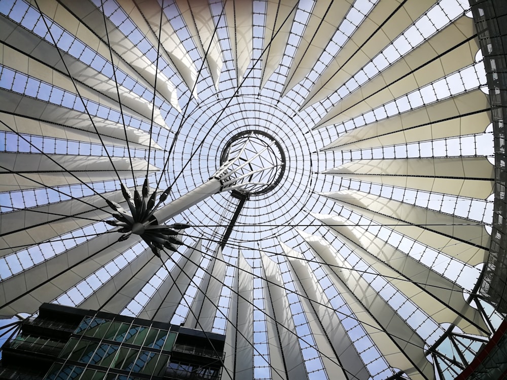 low-angle photography of white dome building interior