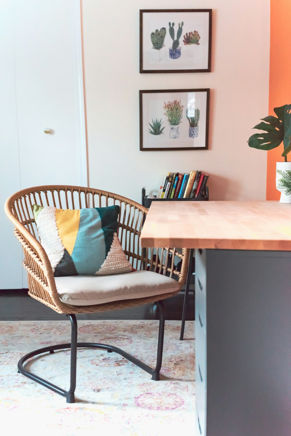 cantilever chair with throw pillow near table