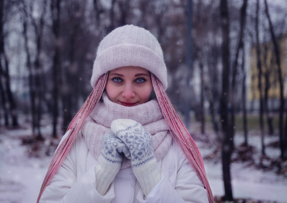 woman wearing coat, gloves, and hat