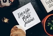 live a life make jealous signage