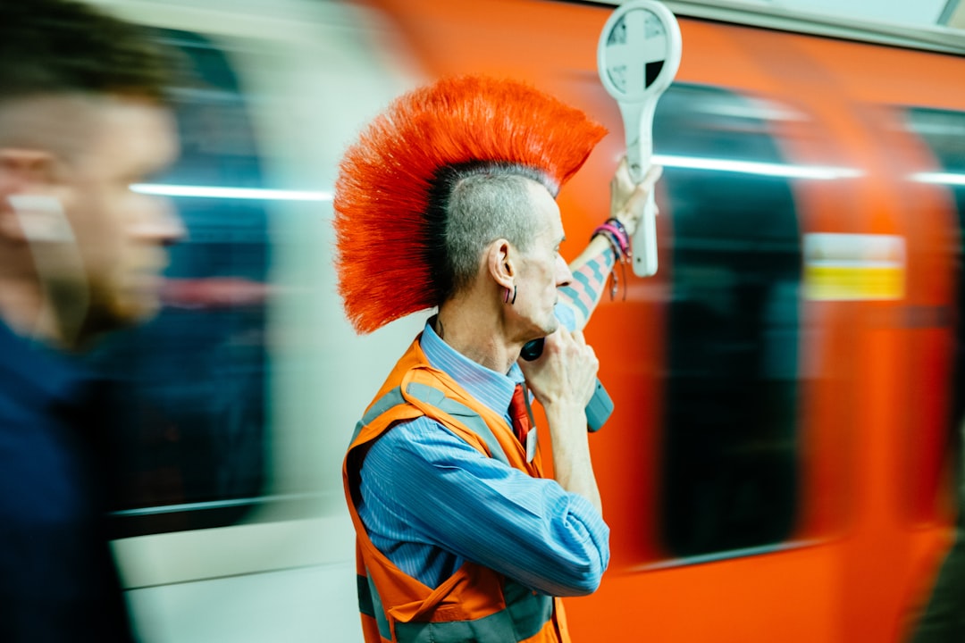 man holding white hand tool