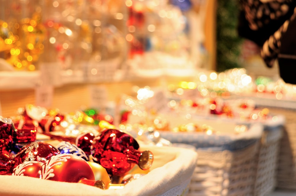 four white wicker basket filled with Christmas decor lot selective focus photography