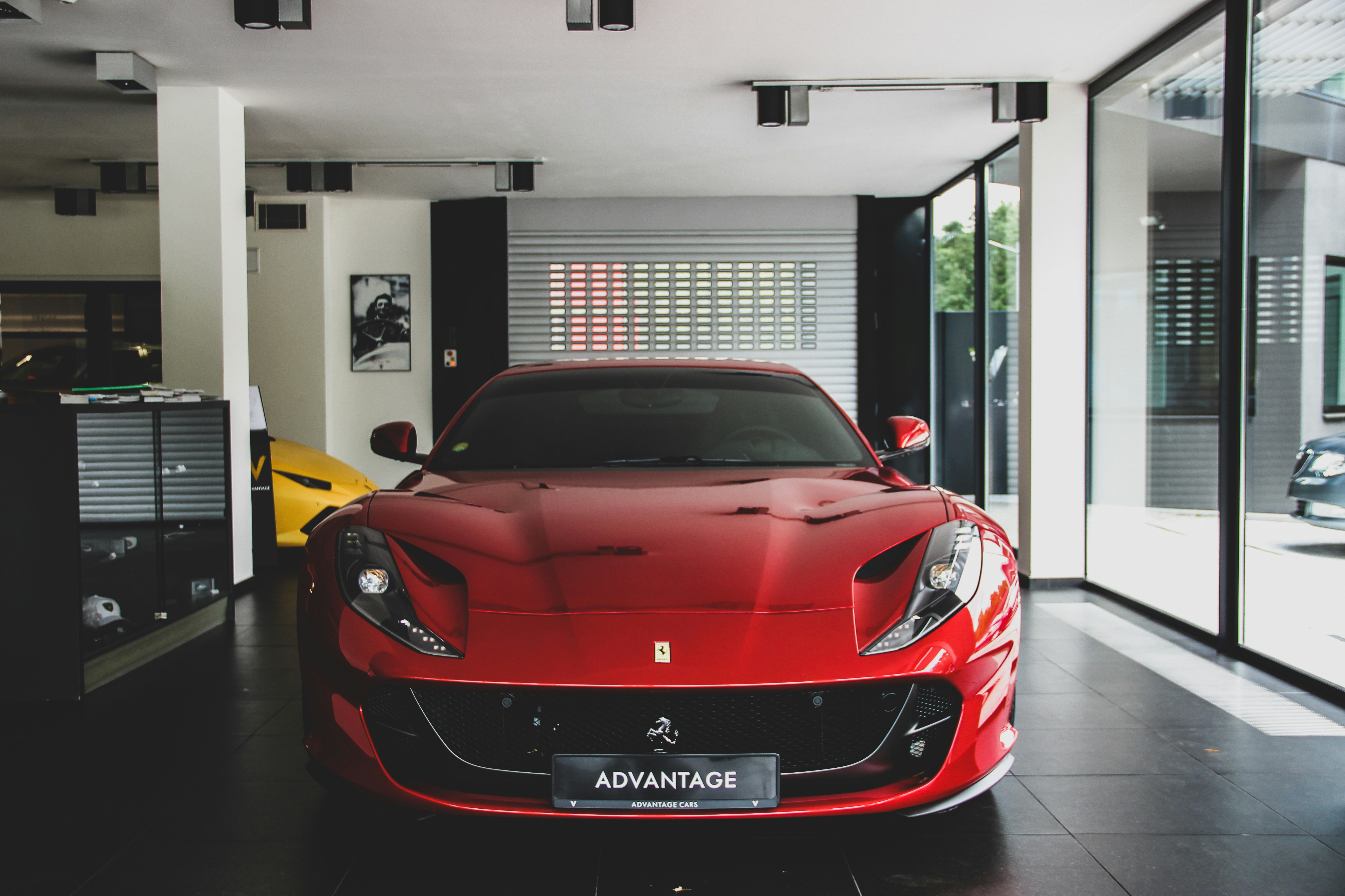 red Ferrari car on park inside building