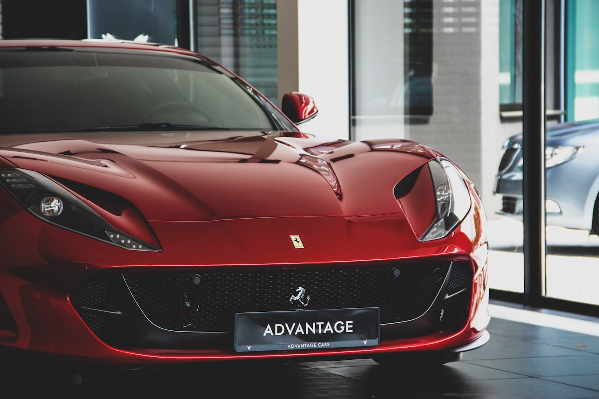 Red Ferrari luxury sports car representing the automaker's record-setting financial performance