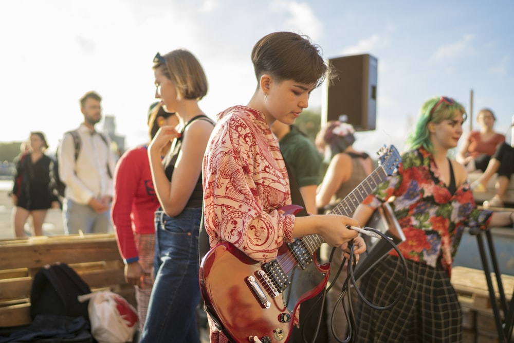 boy playing electric guitar