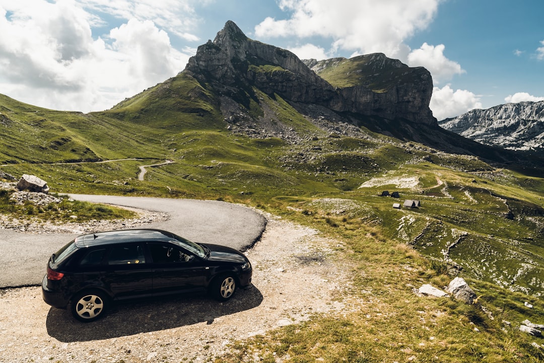 black 5-door hatchback near mountains