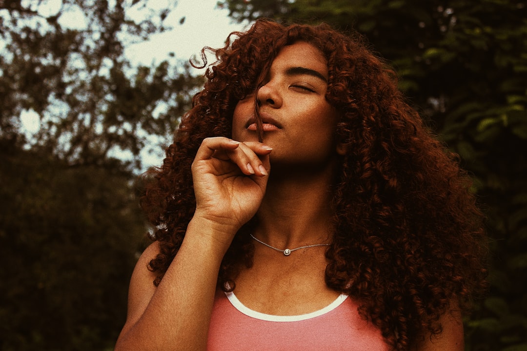 woman holding her hair