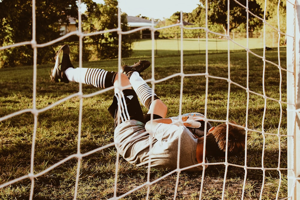 goalie on ground beside net