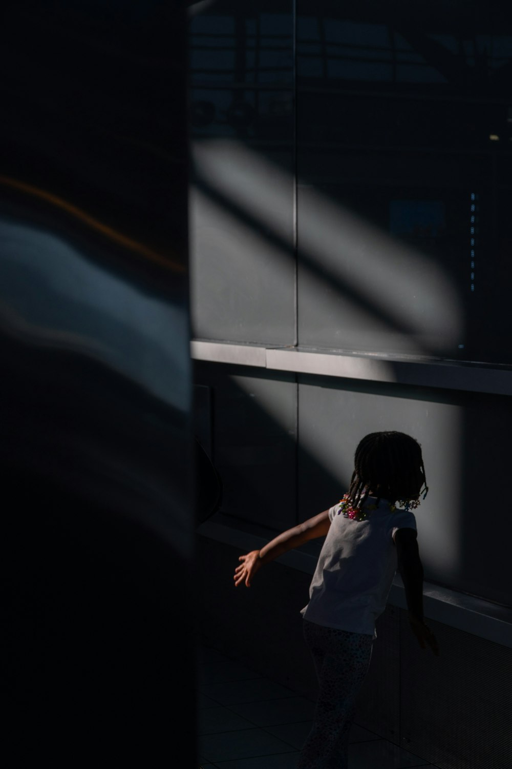 girl in white t-shirt inside dark room