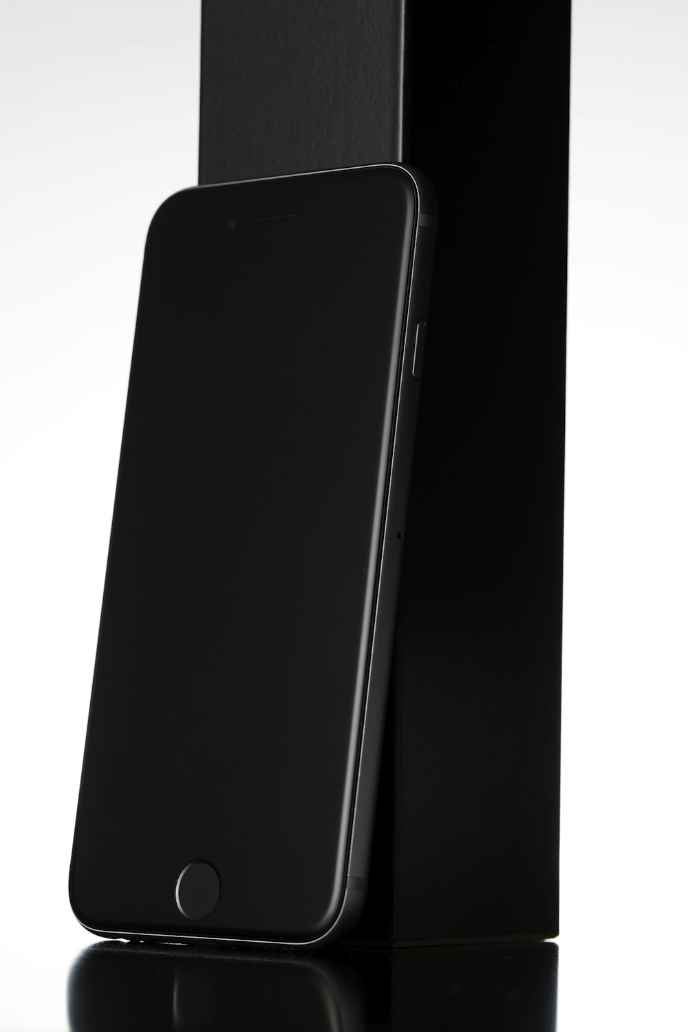 black iPhone 8 leaning black box
