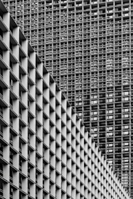 grayscale photography of high-rise buildings