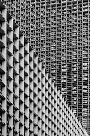 grayscale photography of high-rise buildings