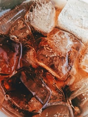 A close-up of ice cubes sparkling in a cold beverage.