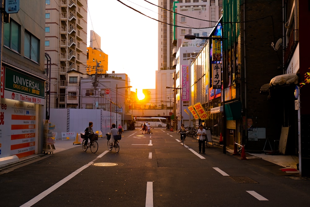 person wearing white shirt riding bicycle on street