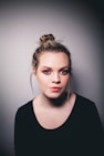woman wearing black scoop-neck top