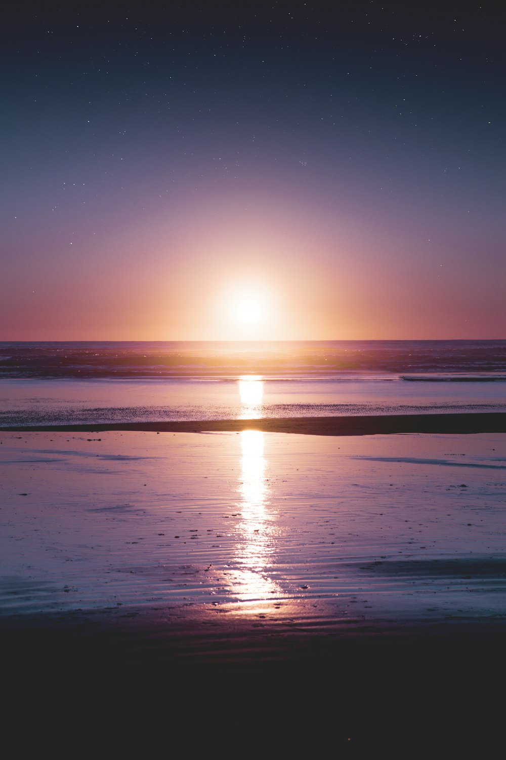 body of water during sunset