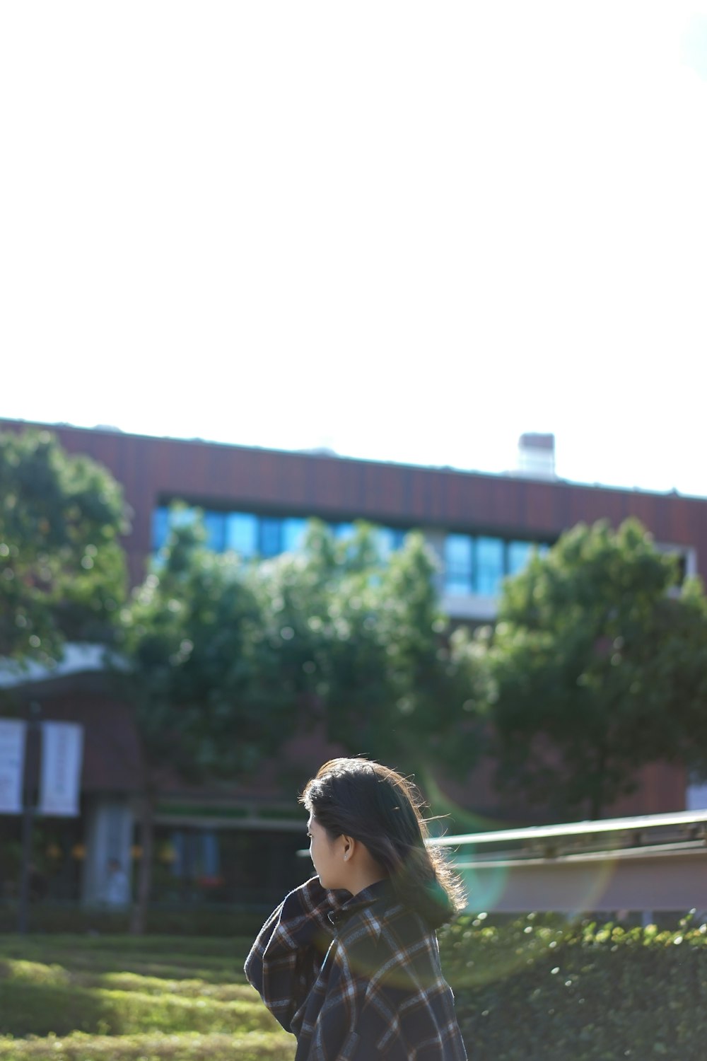 woman beside grass