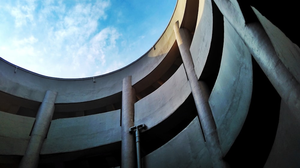 low-angle photography of round concrete building