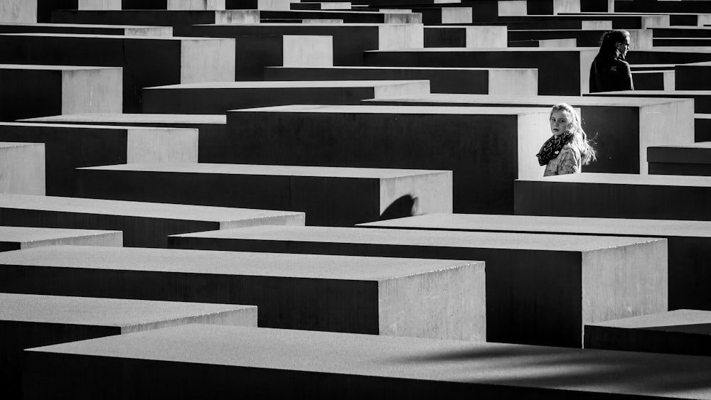 woman standing in the middle of walls