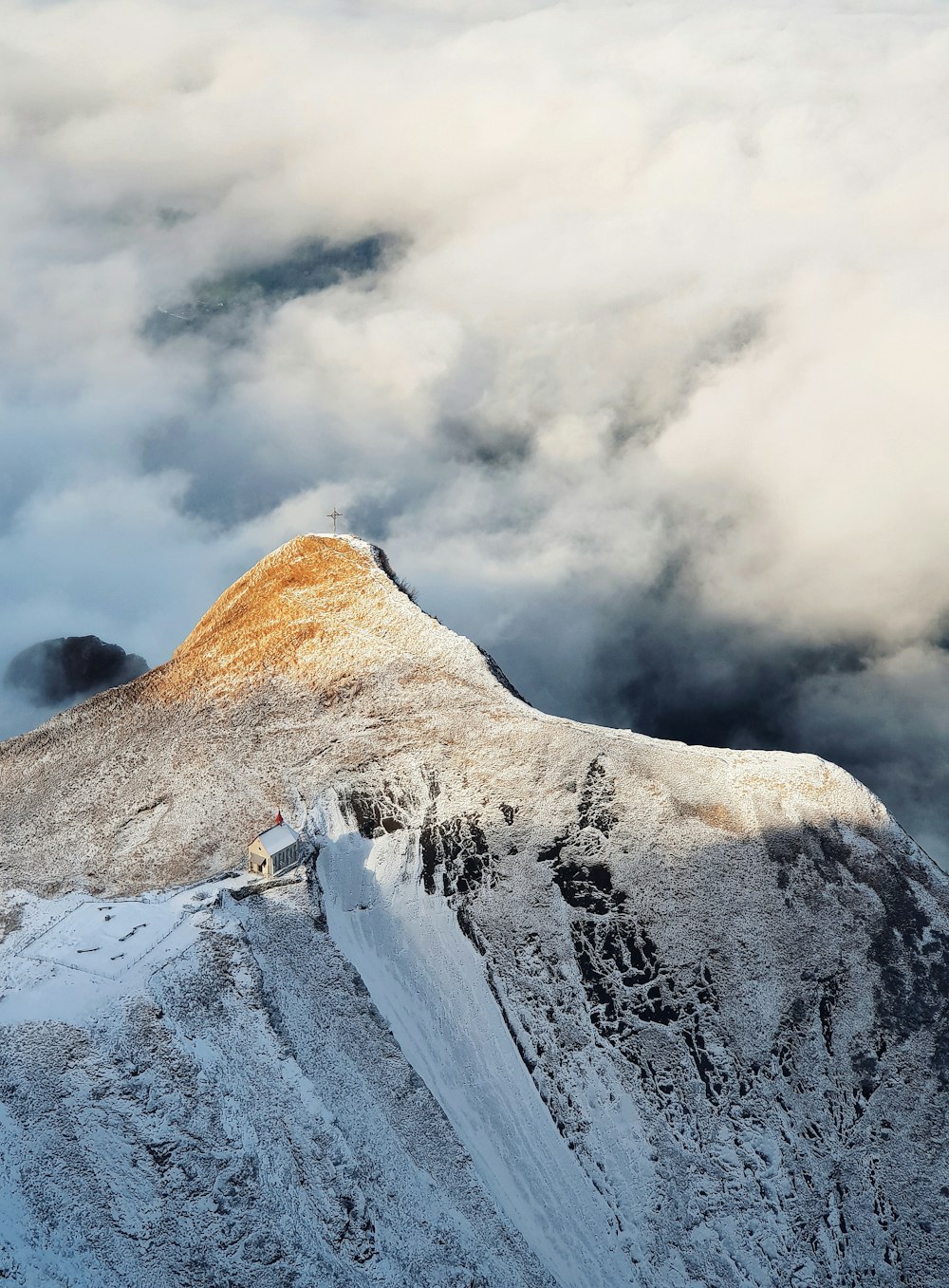 mountain under cloudy sky during daytime