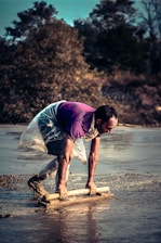 Technician carefully injecting mudjacking slurry beneath a sunken driveway in a Citrus County neighborhood.