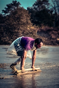 Technician carefully injecting mudjacking slurry beneath a sunken driveway in a Citrus County neighborhood.