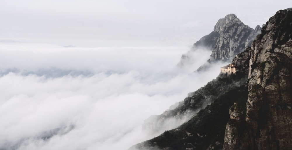 clouds below the twin mountain peaks