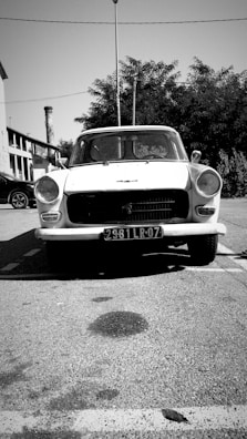 A vintage car parked in a scenic outdoor setting.