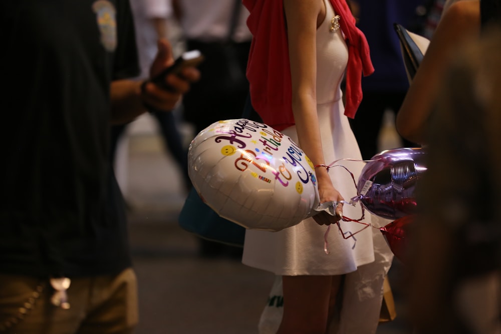 woman holding balloon