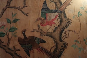 Softly lit pastel painting of a pair of native birds perched on a branch, full of tender emotion