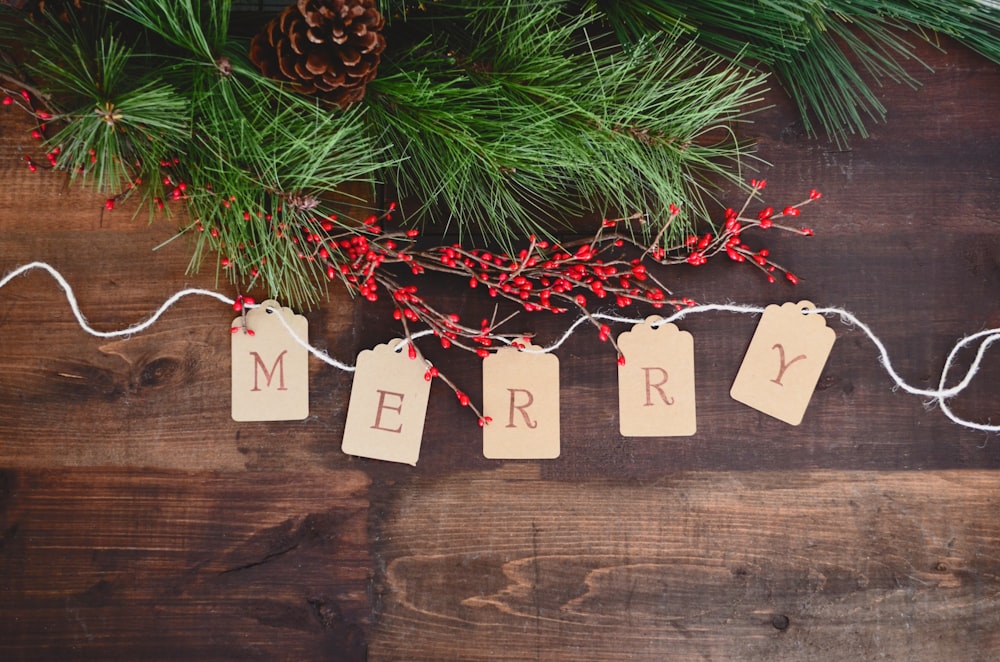 MERRY text cutout on white string by wreath