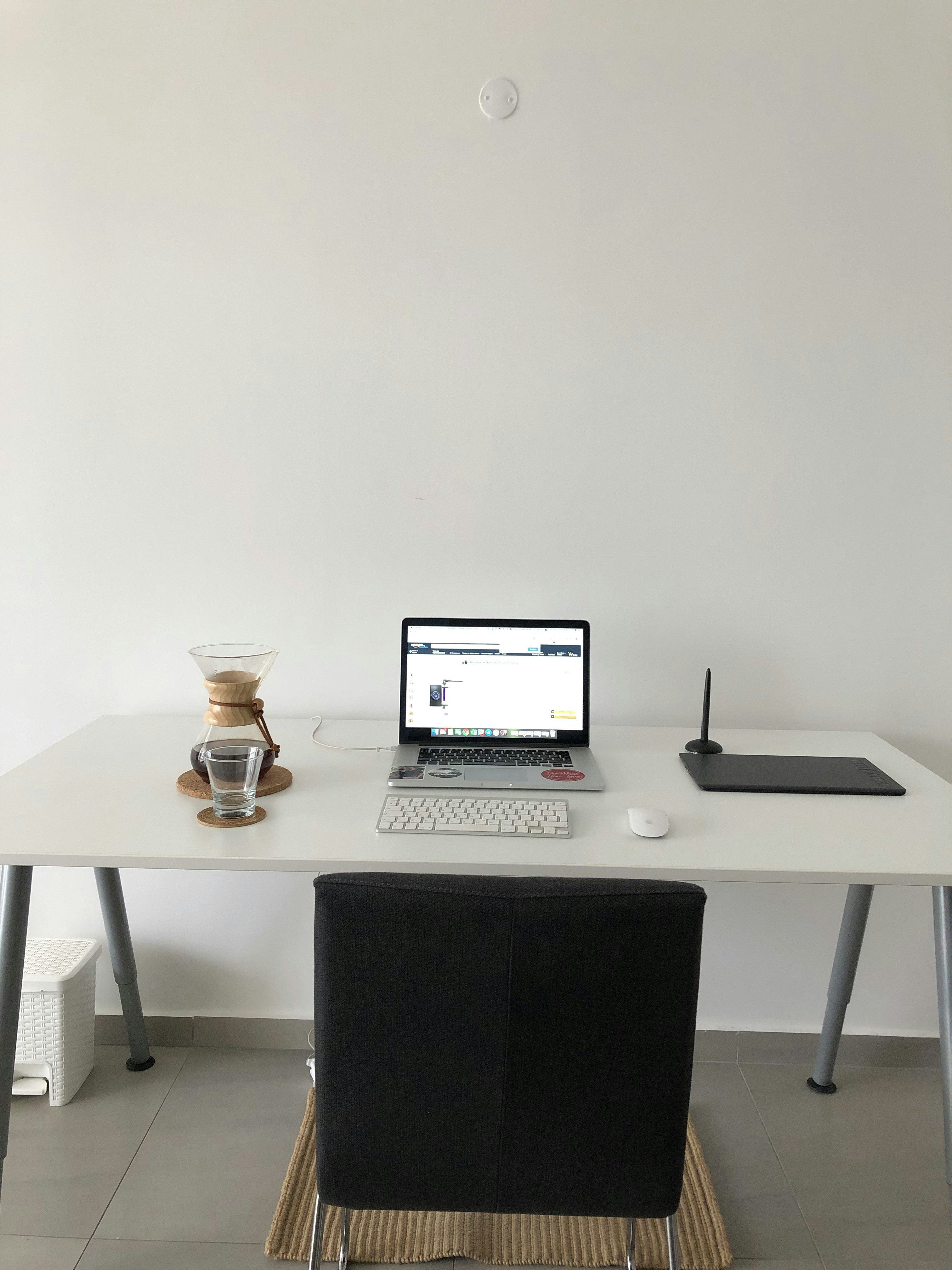 Drawing displayed in natural light on white wall in cozy room setting