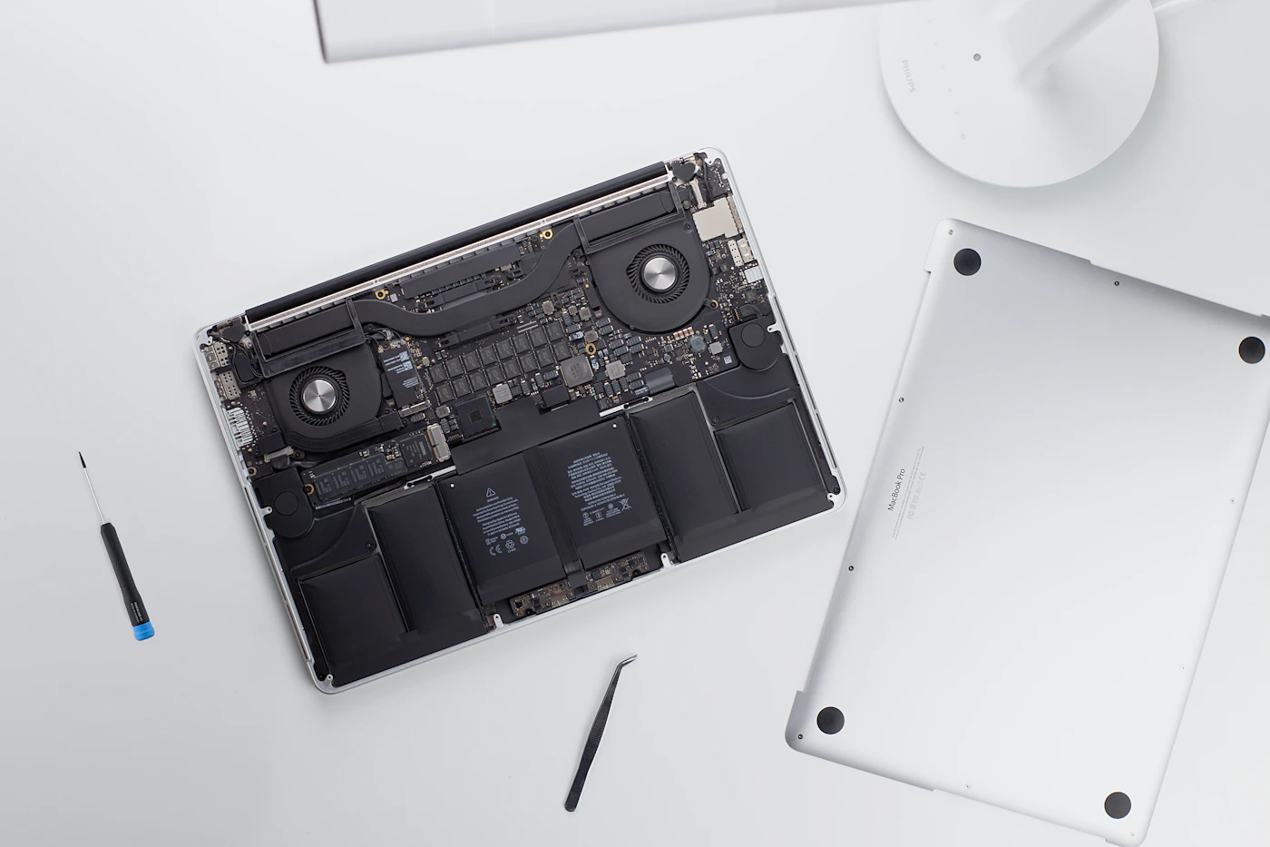 Open MacBook chassis showing internal logic board