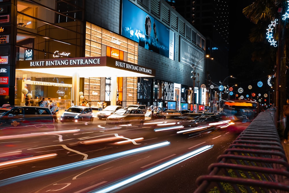 time-lapse photography of vehicles on road during nighttimes