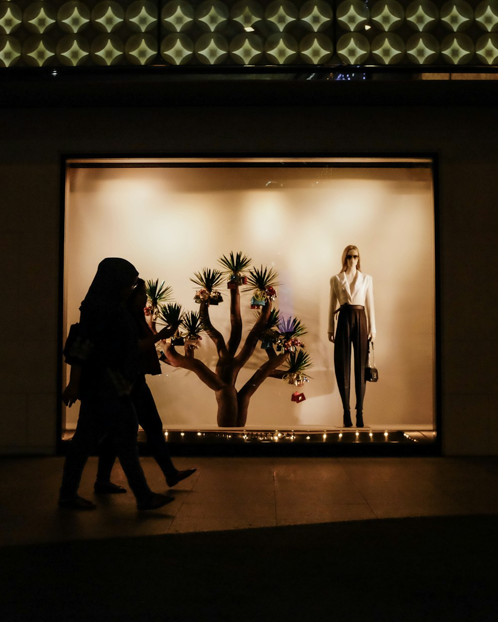 woman walking inside mall