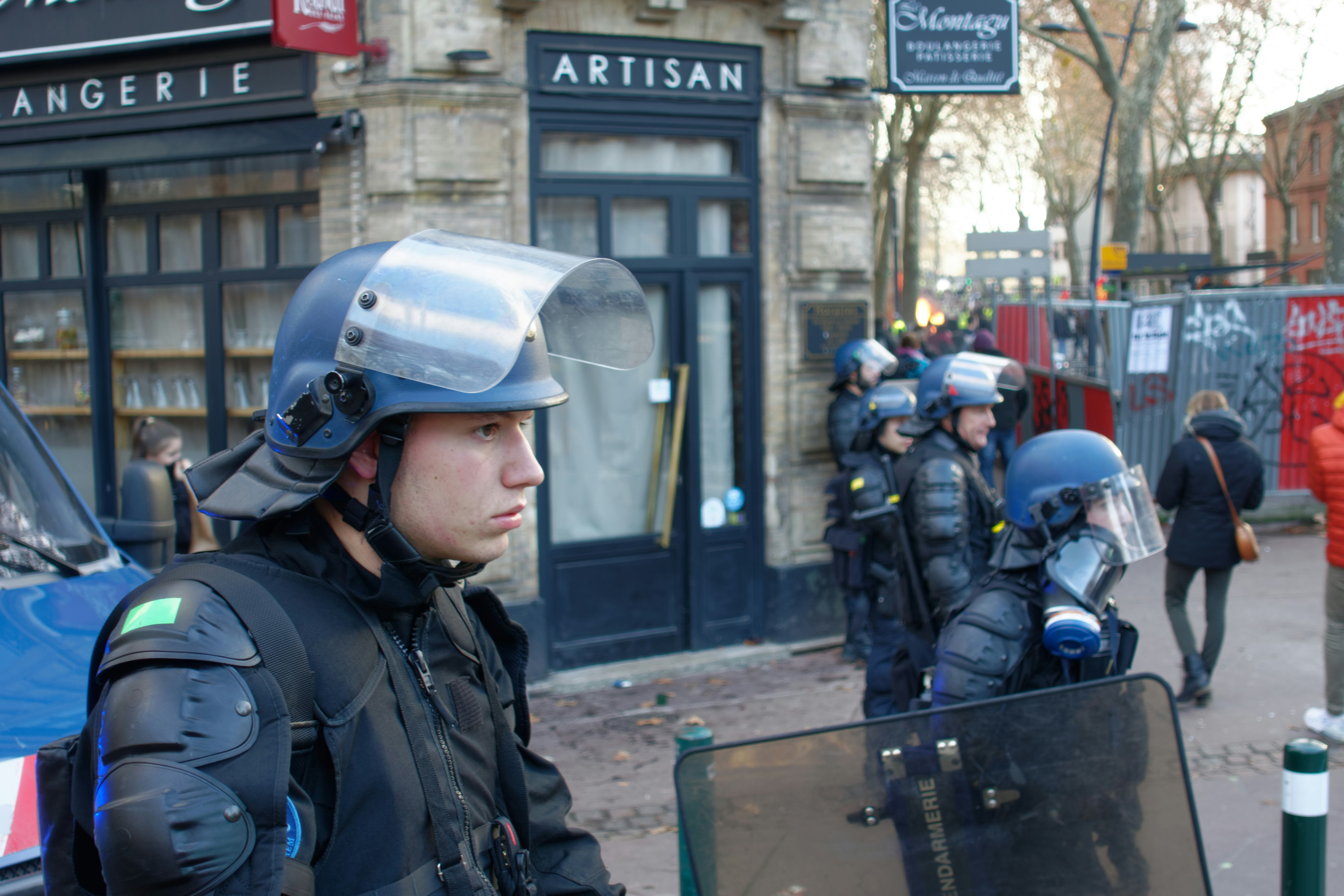 man wearing blue riot helmet