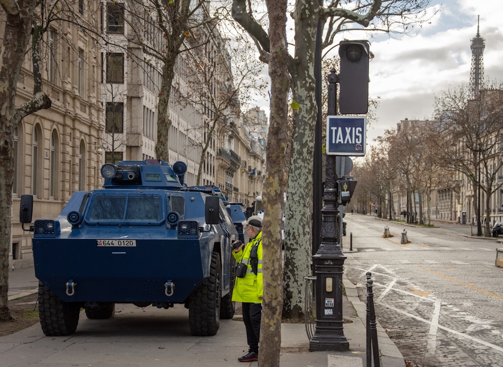 blue ATV truck on sidewalk